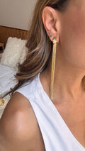 Aretes estrella largos.